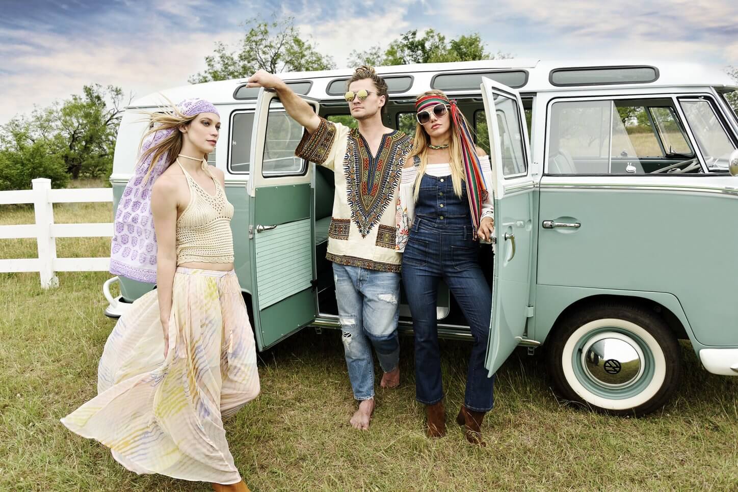 beautiful girl and young couple dressed as hippies with vintage VW