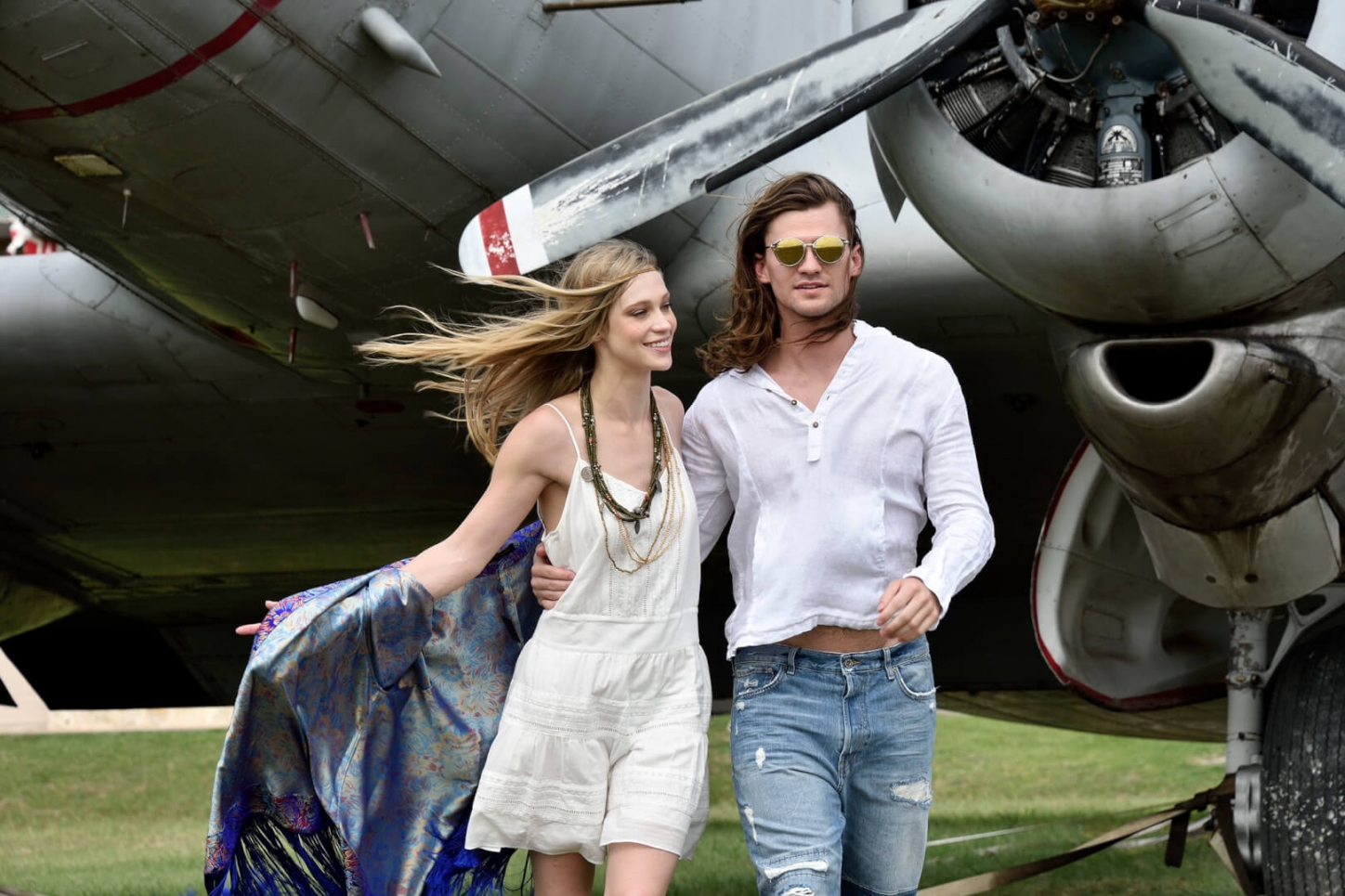 beautiful couple with vintage plane